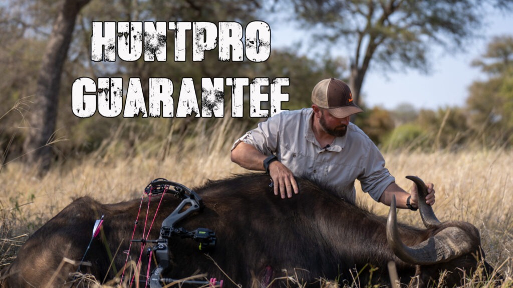 Picture of a man with a cape buffalo and the words HUNTPRO Guarantee.